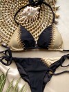 Two-tone bikini in zwart en goud verfraaid met gouden kralen by Mystical Swimwear