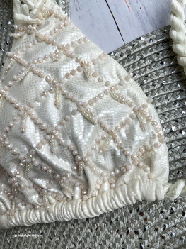White shiny bikini with snake print texture decorated with beads and macrame from Perla Santa Swimwear 2