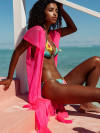 Neon pink poncho with fringes and belt by Luli Fama