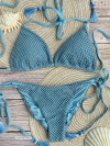 Glinsterende poederblauwe bikini verfraaid met een overlay van netstof en kwastjes van Mystical
